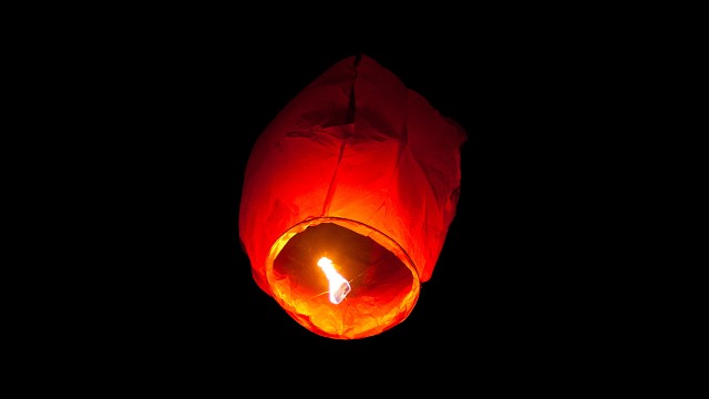 red flying lantern black background