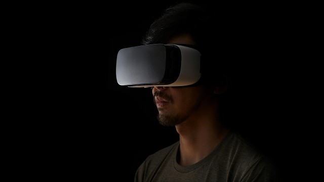 man virtual reality headset black background