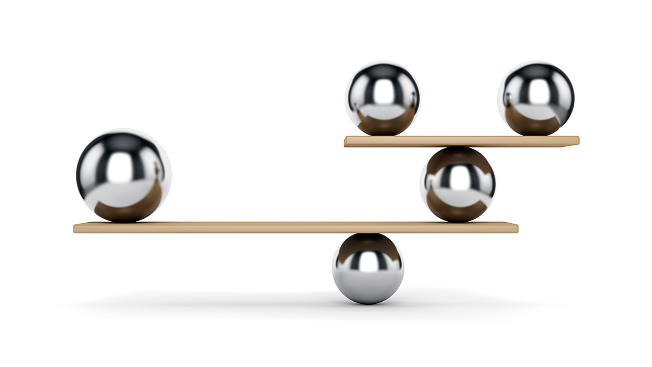 Metal weighted balls balancing on wood slats