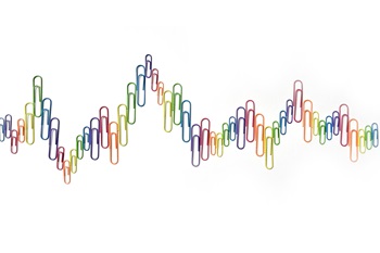 Multicolored paperclips white background