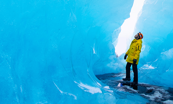 An explorer in an ice cave