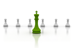 A green king chess piece stands in front of 6 white pawns