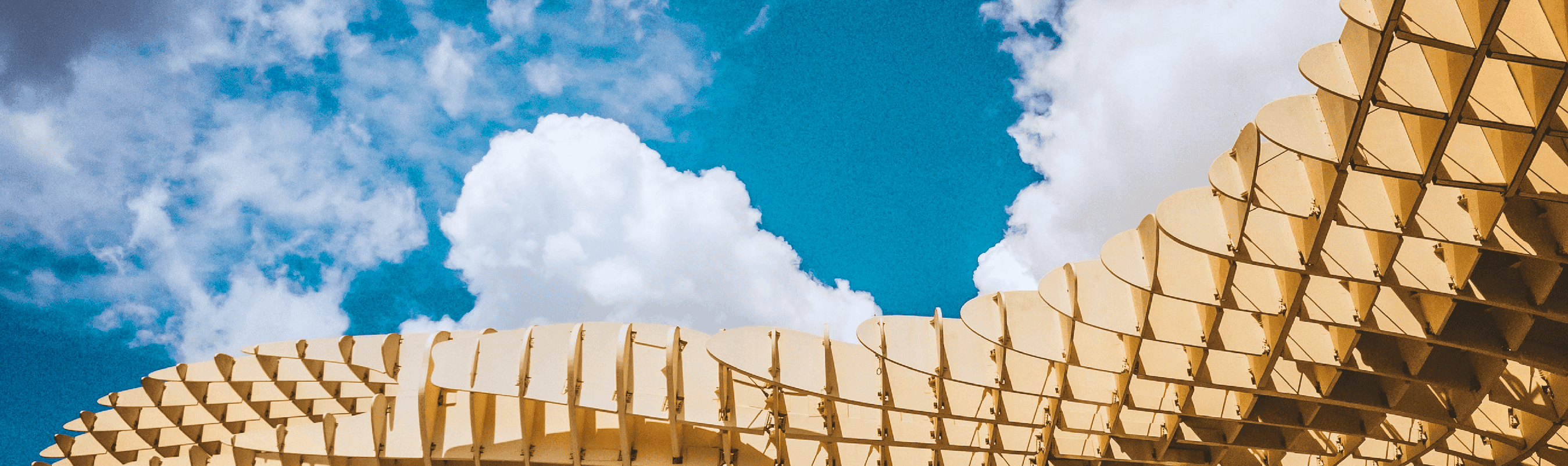 Looking up at the sky with an intricate building structure in front of it