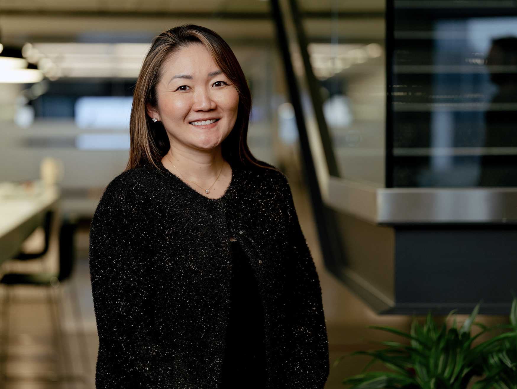 Professional woman smiling in modern office