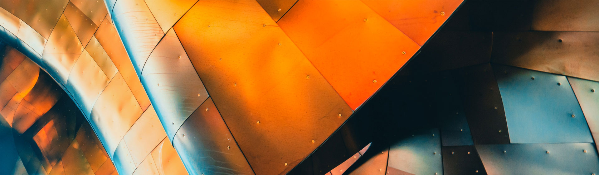 Abstract metallic surface with warm reflections