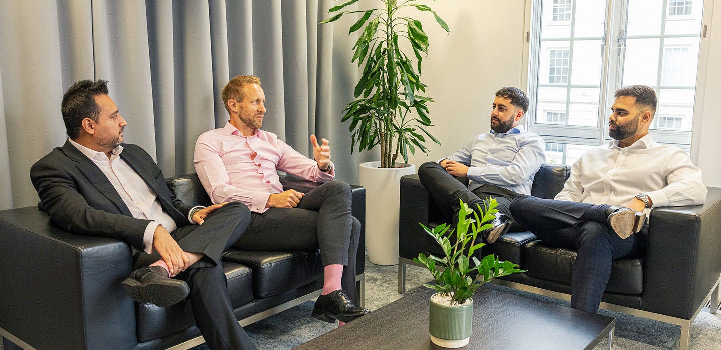 Business colleagues having informal office meeting