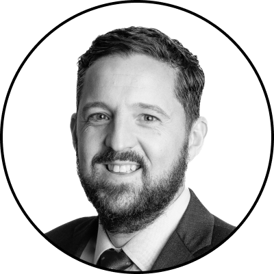 Black and white portrait of suited man