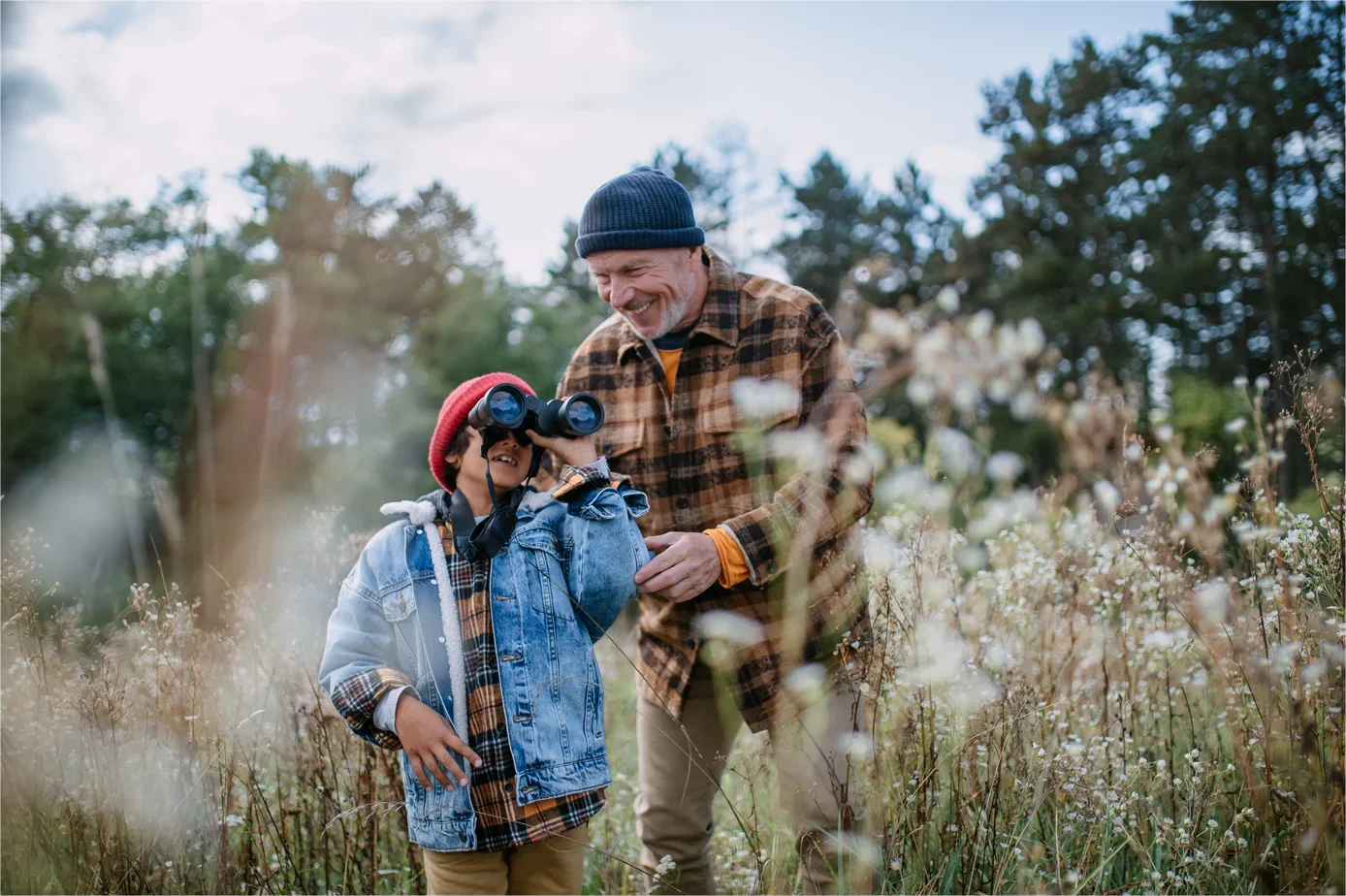 Father and child exploring nature outdoors