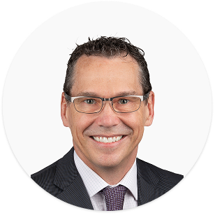 Professional headshot of suited businessperson