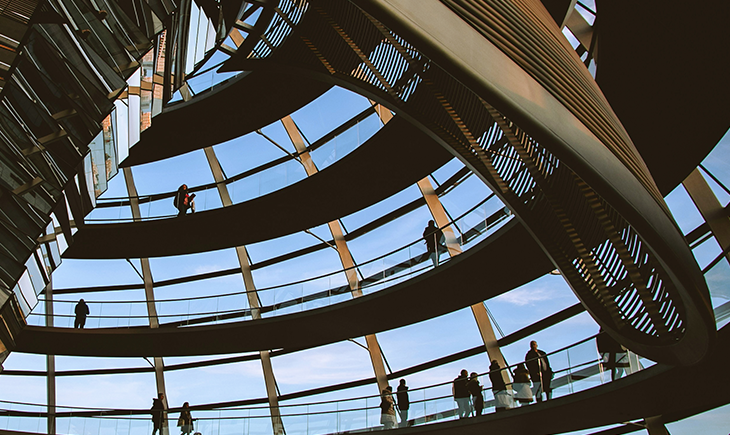 People walking on the spiral ramp inside the Reichstag dome in Berlin, Germany.