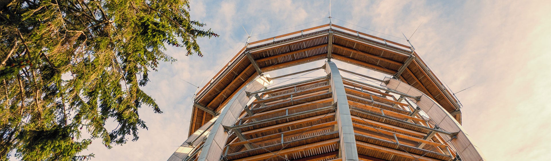 Modern wooden observation tower at sunset