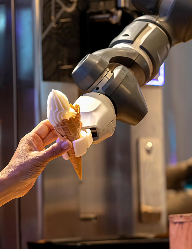 robot hand holding ice cream cone