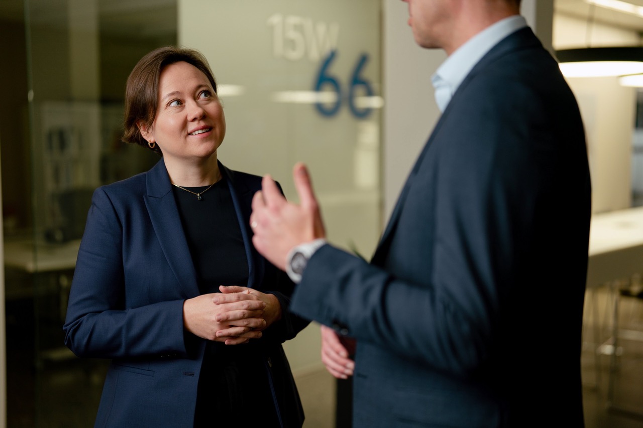 Evgenia Gvodeza, Ph.D. and Paul Eitelman, CFA conversing