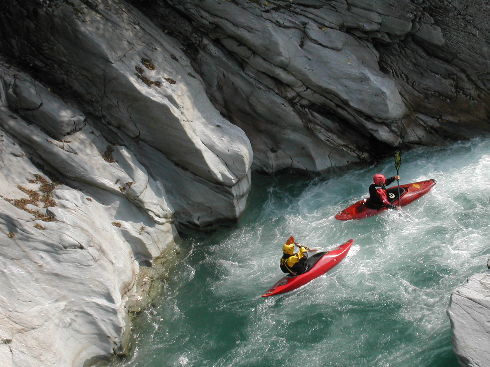two people river rafting
