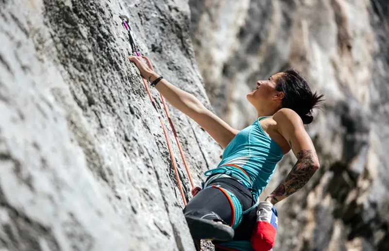 woman rock climbing
