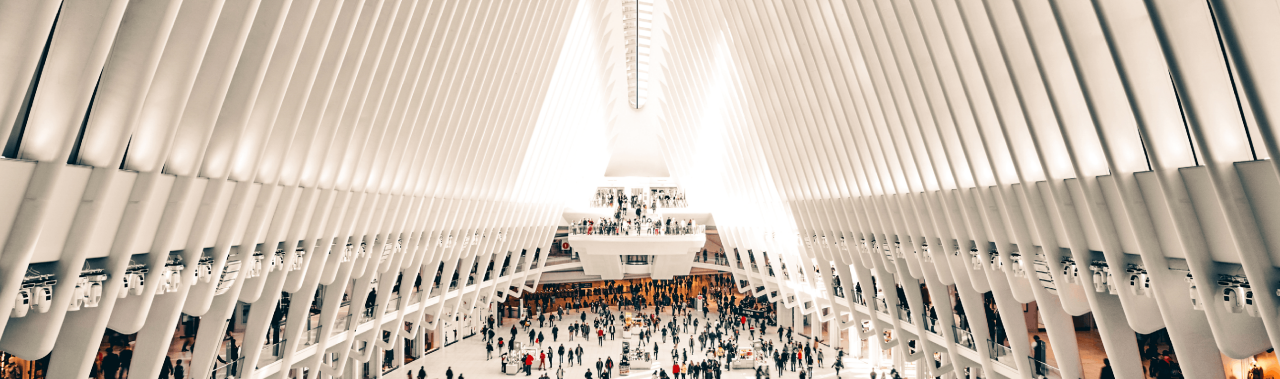People walking around in an intricately made building