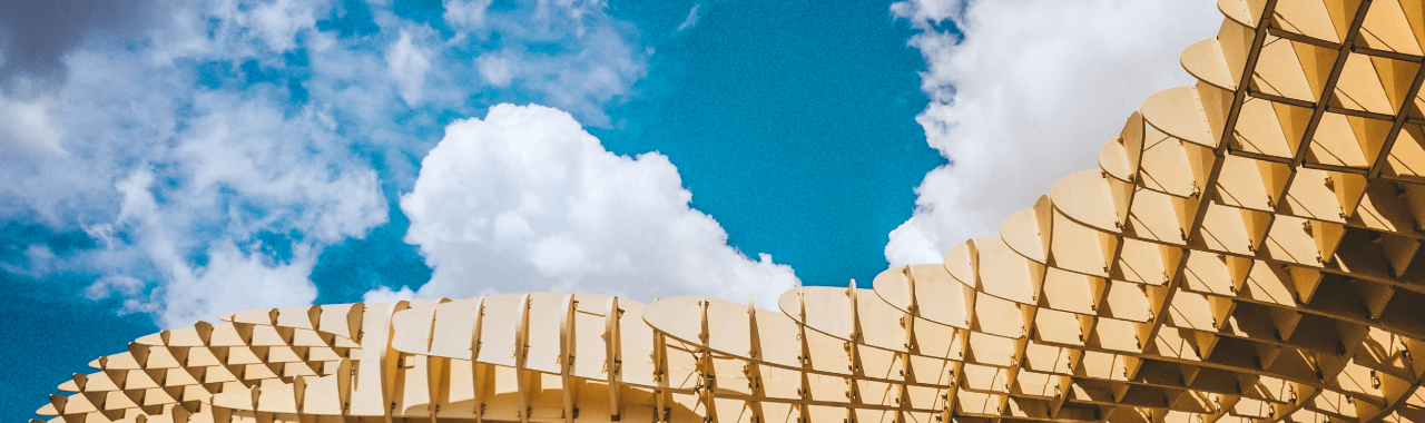 Looking up at the sky with an intricate building structure in front of it