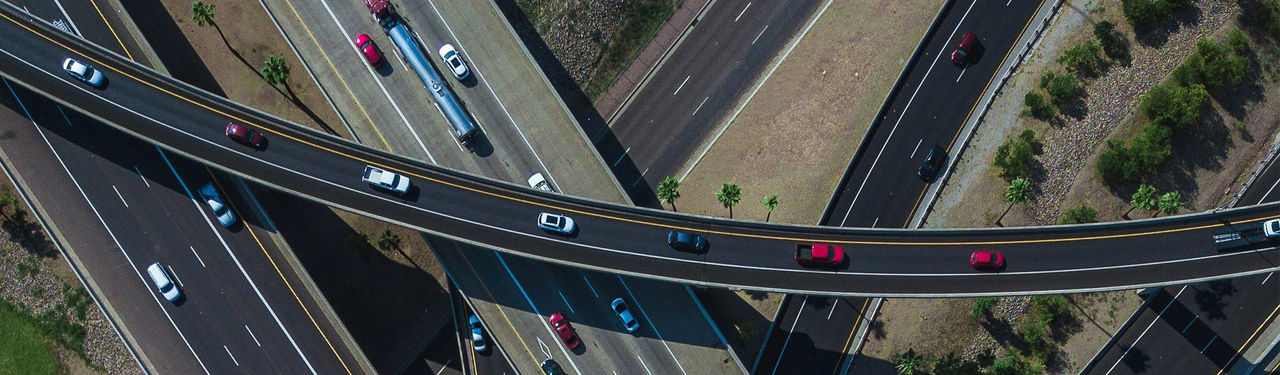 Aerial view of busy highway overpass with cars