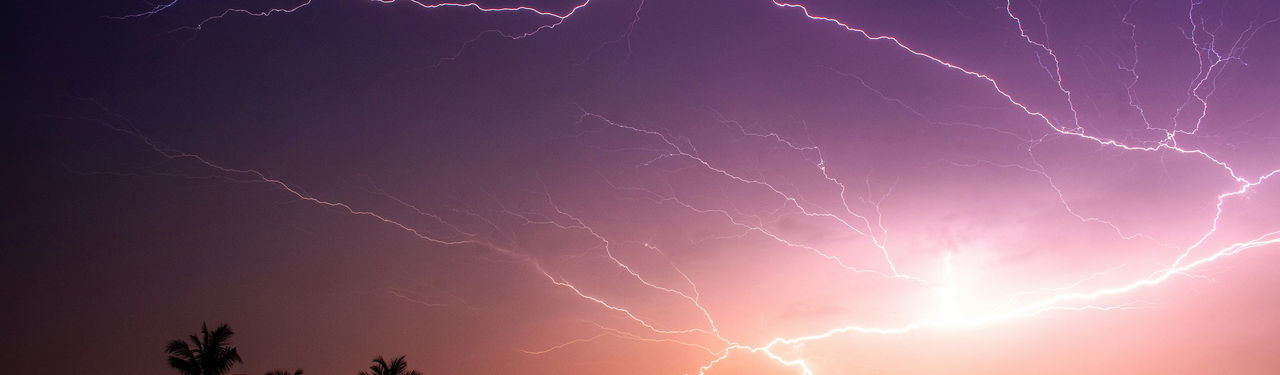Vivid lightning storm over dark horizon
