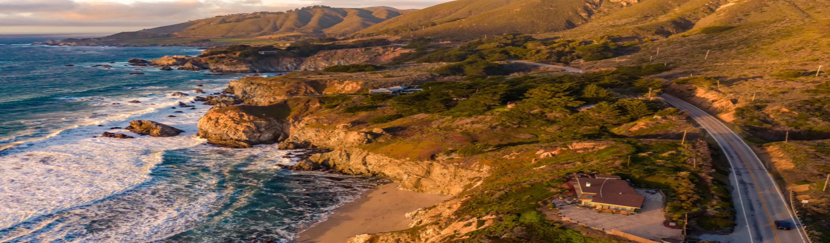 Coastal highway winding along rugged shoreline