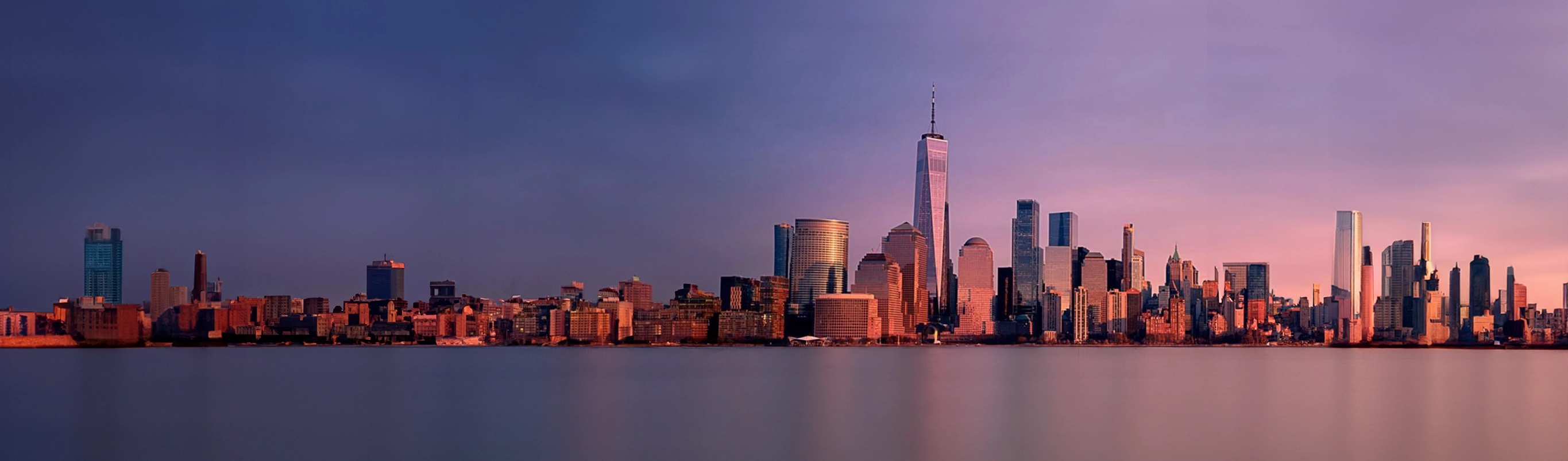 Panoramic view of city skyline at sunset