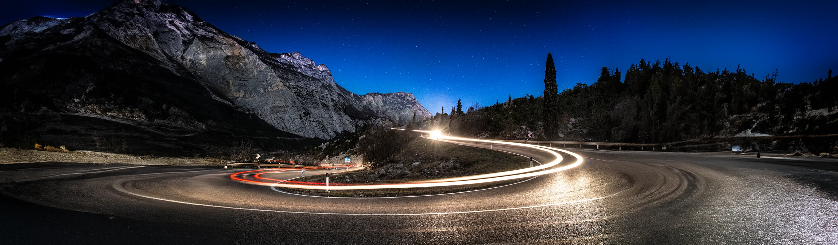 Cars on a mountain road showing motion