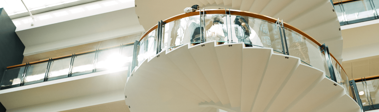 Modern spiral staircase in bright atrium
