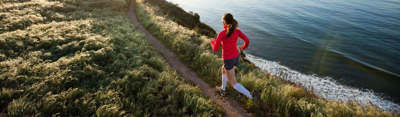 A female trail running near Santa Barbara.