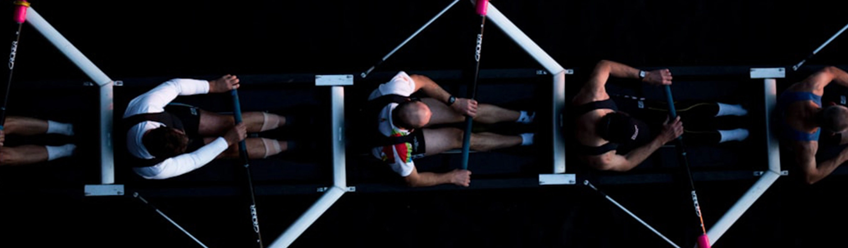 Rowing team in synchronized motion