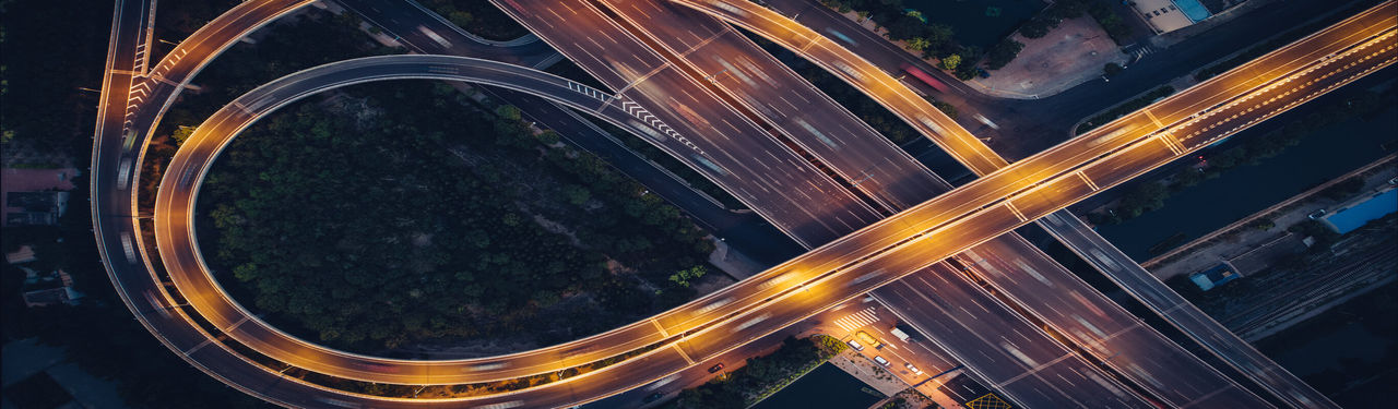 Aerial view of illuminated highway interchange
