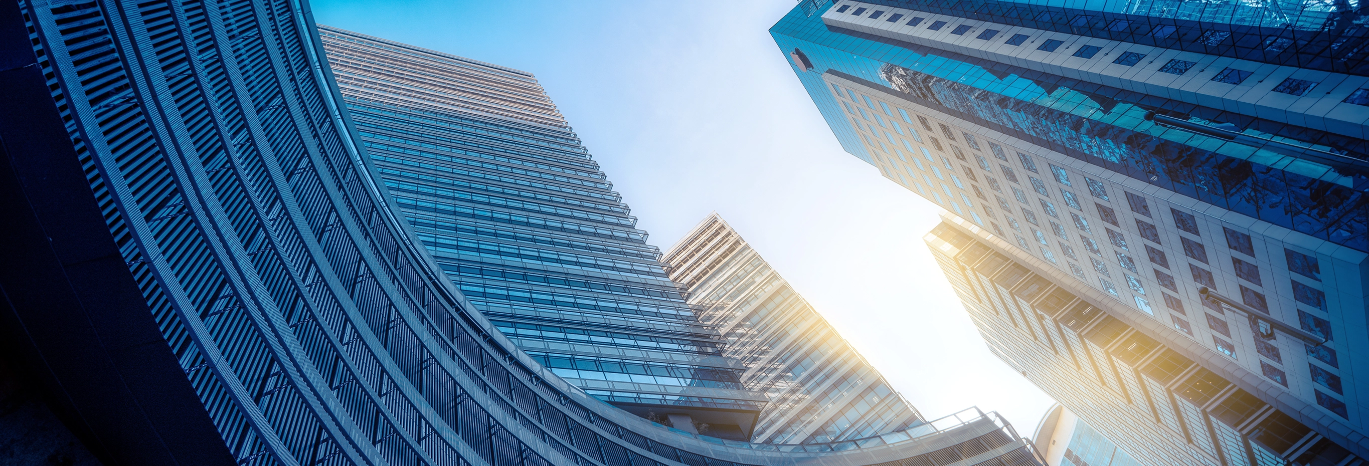Modern skyscrapers with glass facades at sunrise
