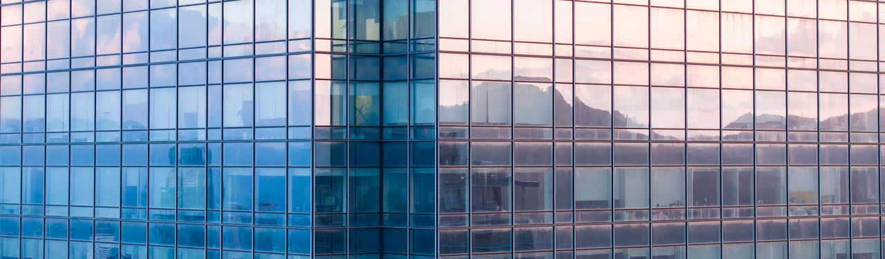 Conceptual photography with black and yellow paper airplanes on a smudged blackboard.
