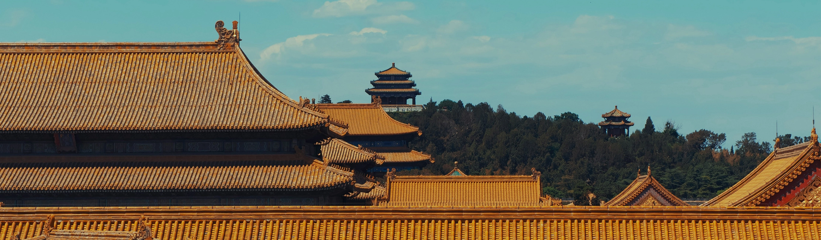 Traditional Chinese Palace Rooftops Under Blue Sky