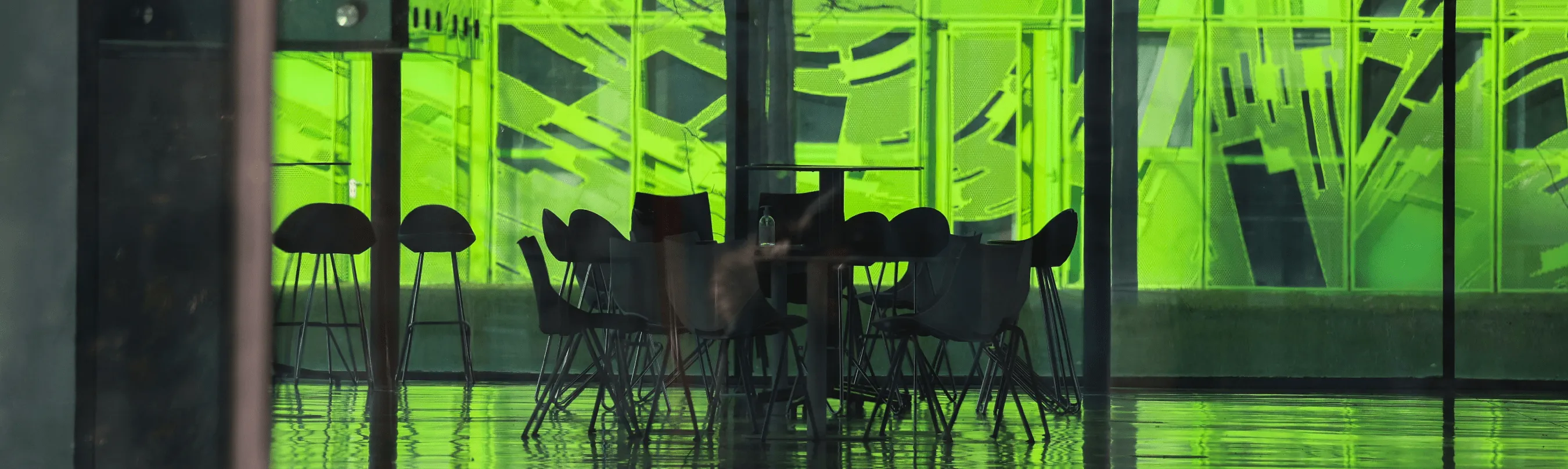 Modern conference room with green glass walls