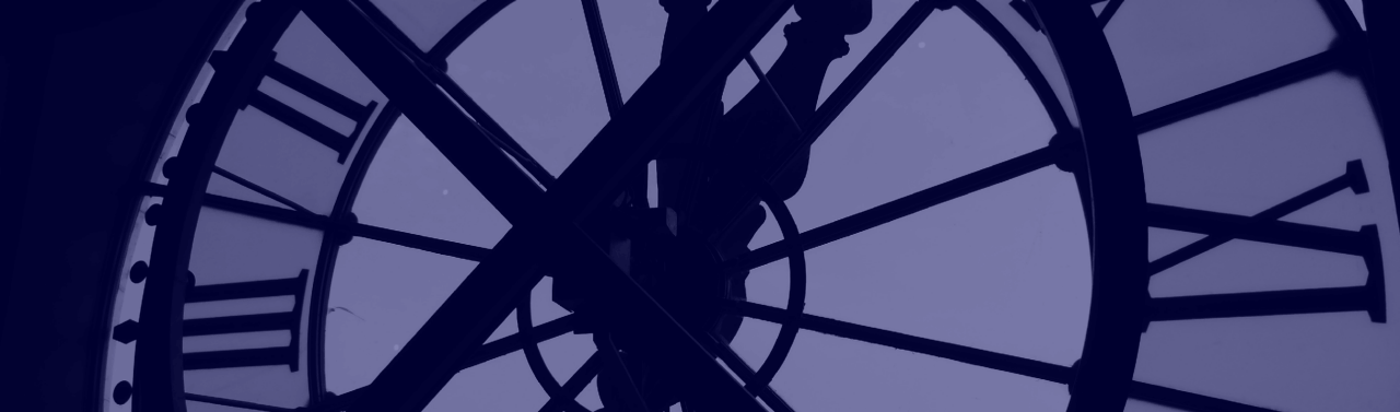 Silhouetted View Through Large Clock Face